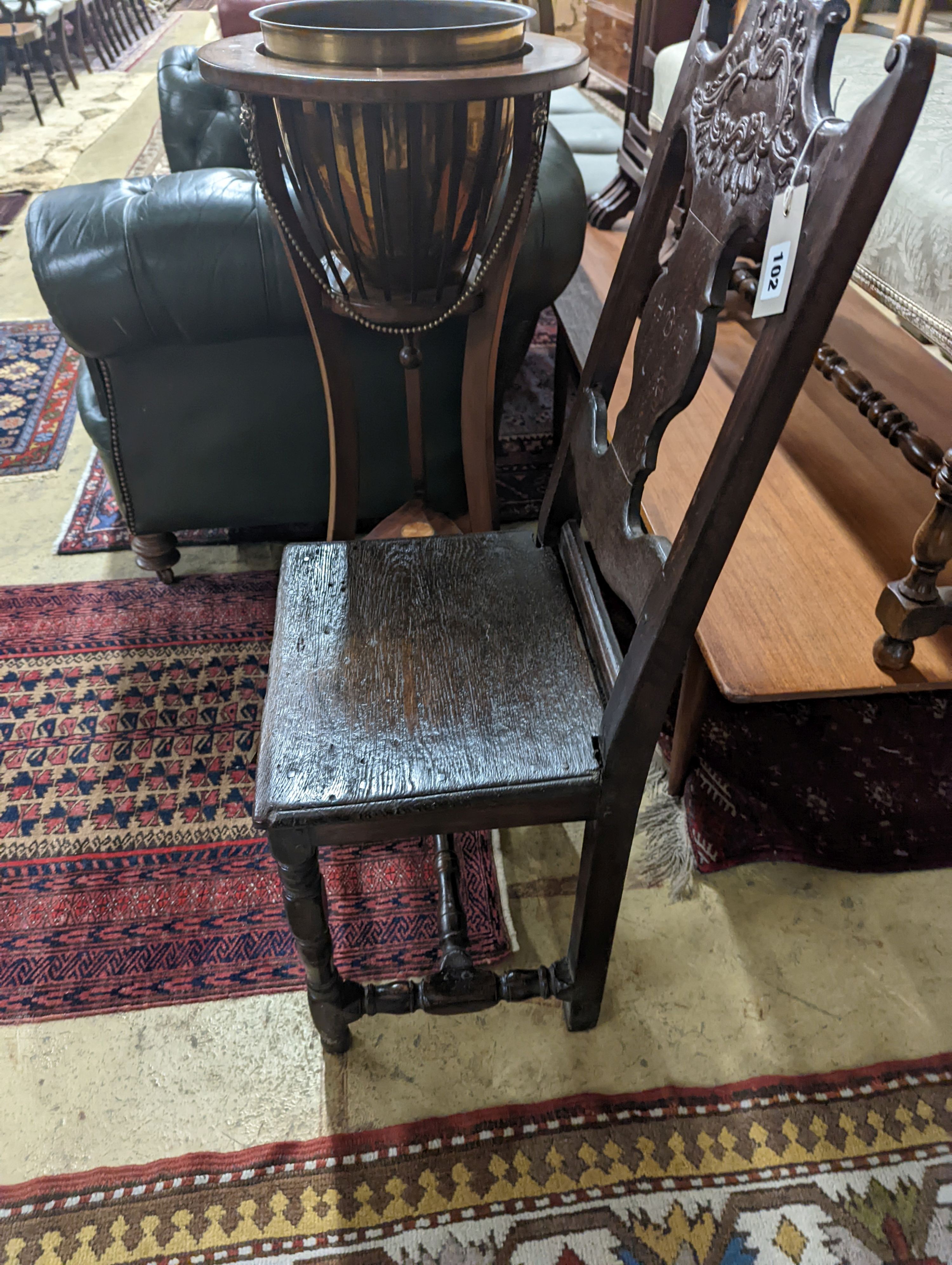 A 17th century style Continental oak back stool, width 40cm, depth 34cm, height 102cm